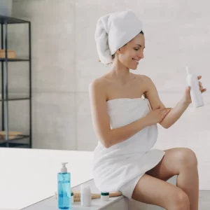 Woman enjoying a clean bathroom after a deep house cleaning service in Mckinney TX